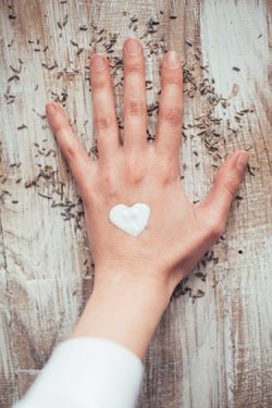 Hand with moisturizer-shaped heart
