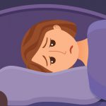 woman laying in bed unable to sleep