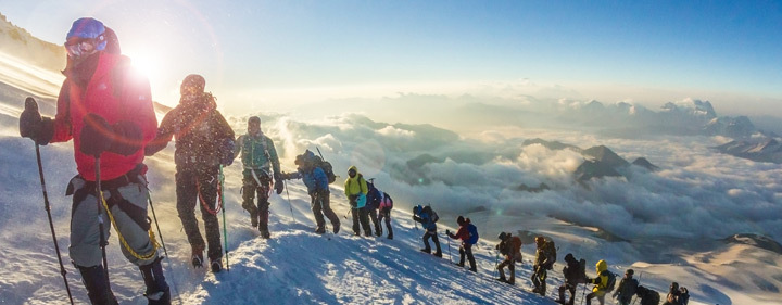 Hikers climbing mountain