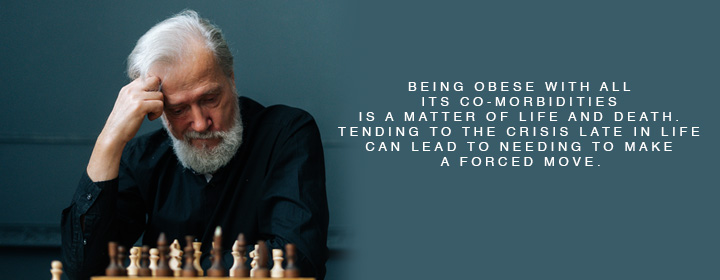 Man making a forced decision, looking down at a chessboard.