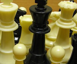 Chess pieces cramped together. Members have felt cramped by TOPS' excessive rules on recognition, making success feel out of reach. We're making progress with updates.