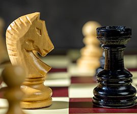 A knight and a rook on a chess board. "Moving in a straight line seems simple. I wish my journey to a healthier me would have been in a straight lines. However, we know that weight loss is not linear and will always have its ups and downs."
