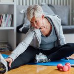 Mature woman exercising at homMature woman exercising at home