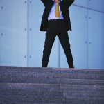 Businessman Raising Arms