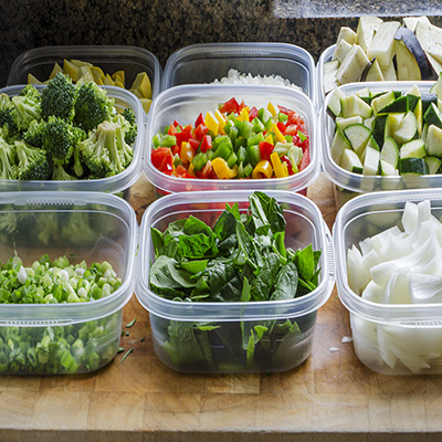 reduce food waste by chopping vegetables into plastic containers