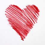 sketch of red crayon heart on white background