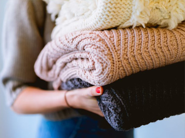 Woman Folding Laundry