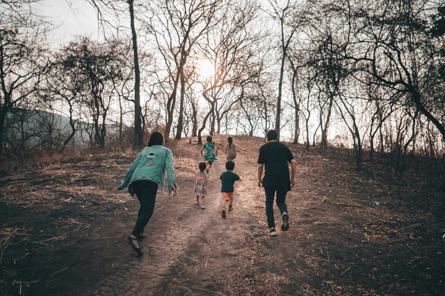 Making Fitness “Family Friendly”, a family hikes together in a park