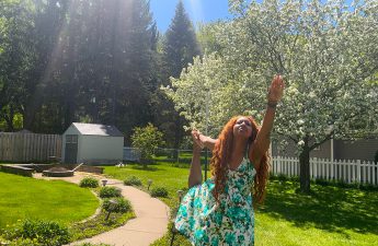 Pictured: Rachel Werner, TOPS Nutrition and Fitness Editor, stays active by stretching outdoors.